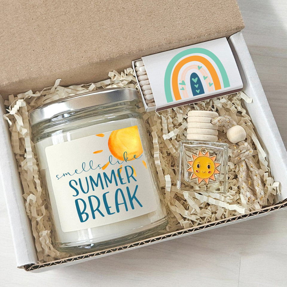 Gift set with a candle labeled 'Smells like Summer Break' and a small bottle with a rainbow design.