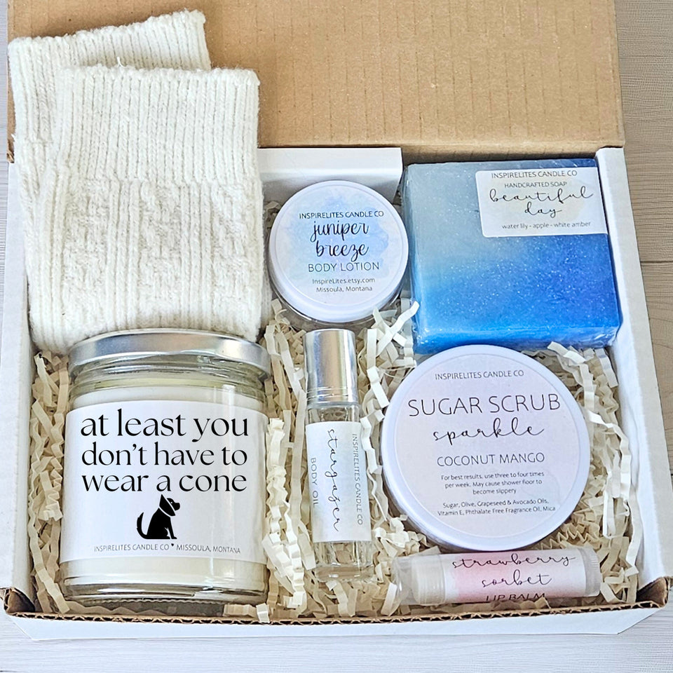 Gift set with candles, soap, and other items in a box